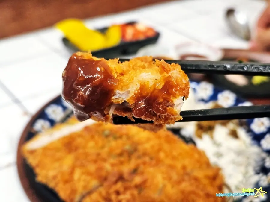 Picking up a piece of the pork loin katsu