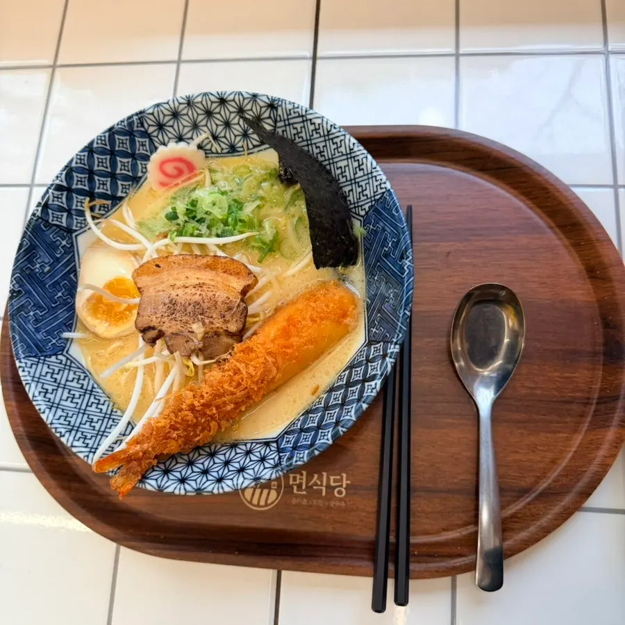 Ordered noodle dishes and side dishes laid out