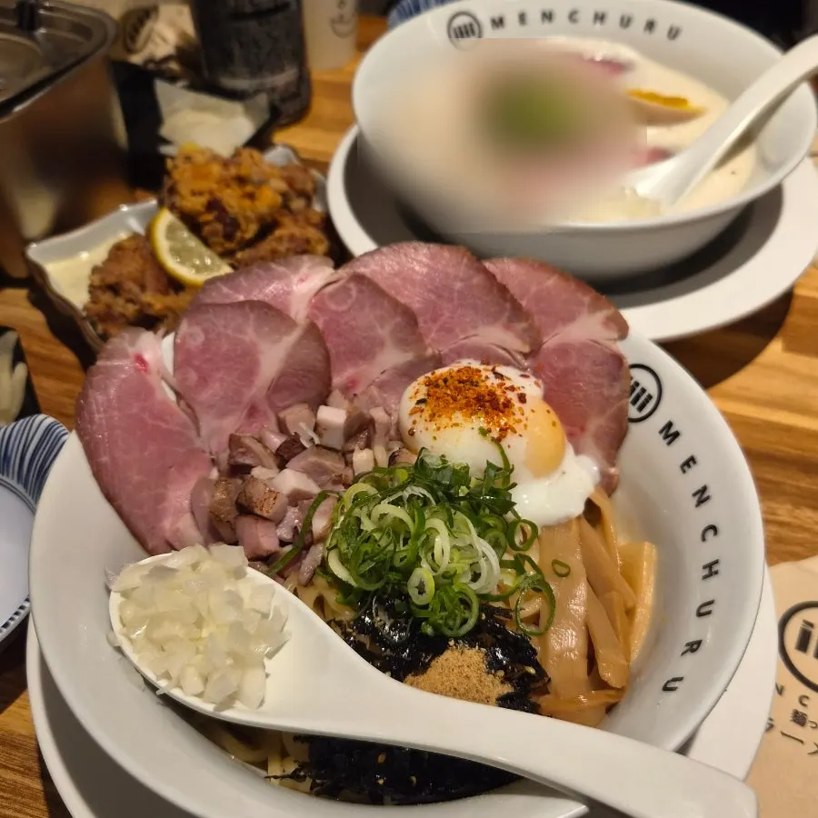 A spread of abura soba, tori paitan, and handmade karaage