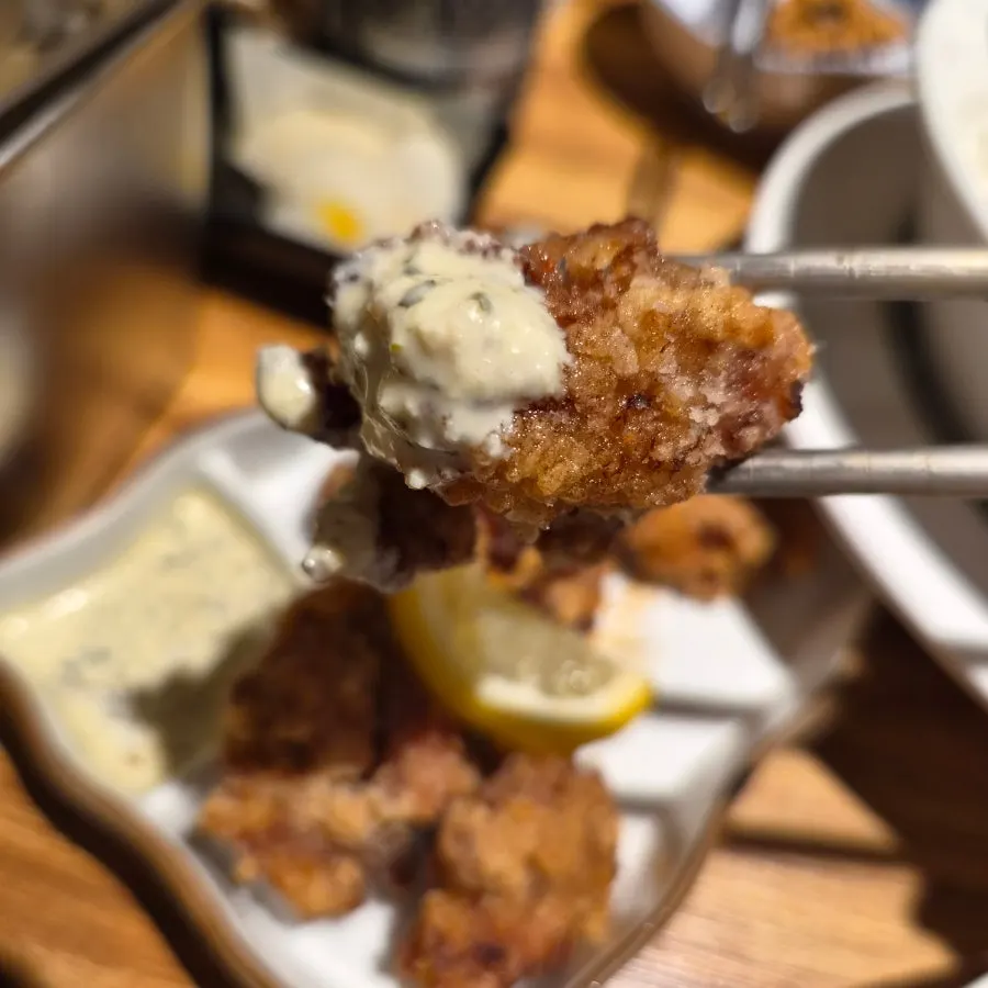 White tartar sauce served alongside the karaage