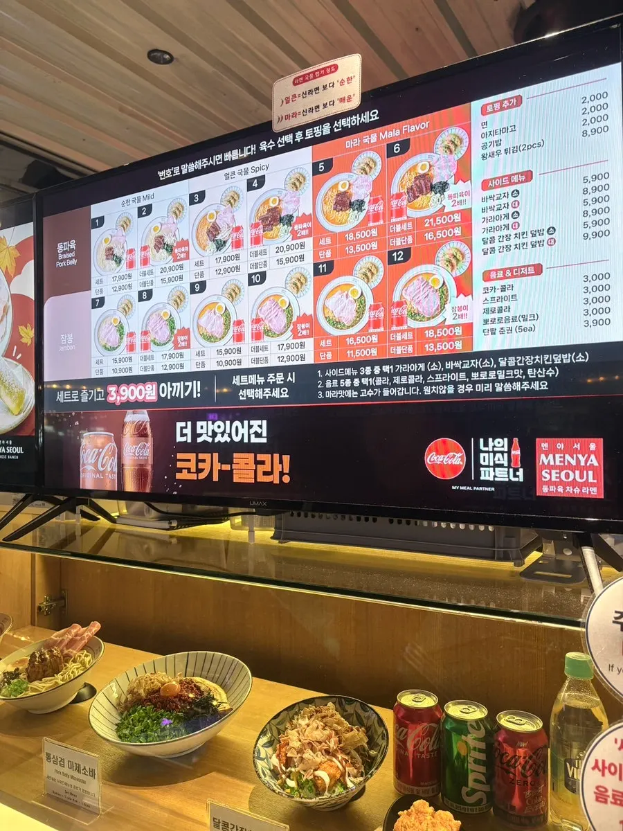 Ordering scene at Menya Seoul with each person choosing a different dish