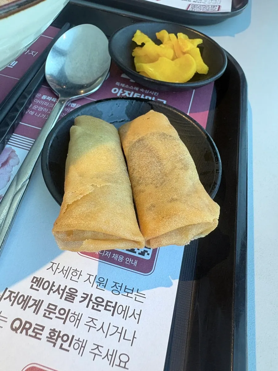 Pickled radish and sweet red bean spring rolls served with the mazesoba