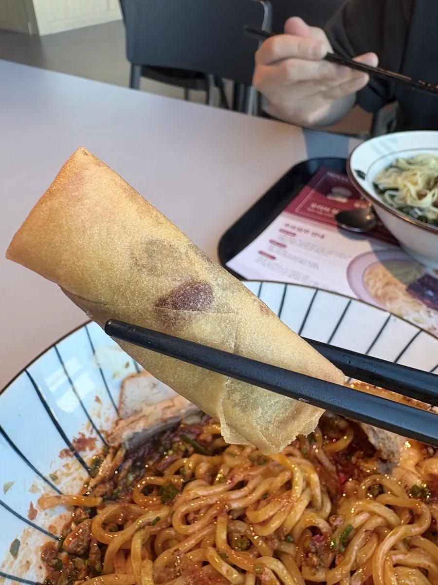 Sweet red bean spring roll eaten as a palate cleanser