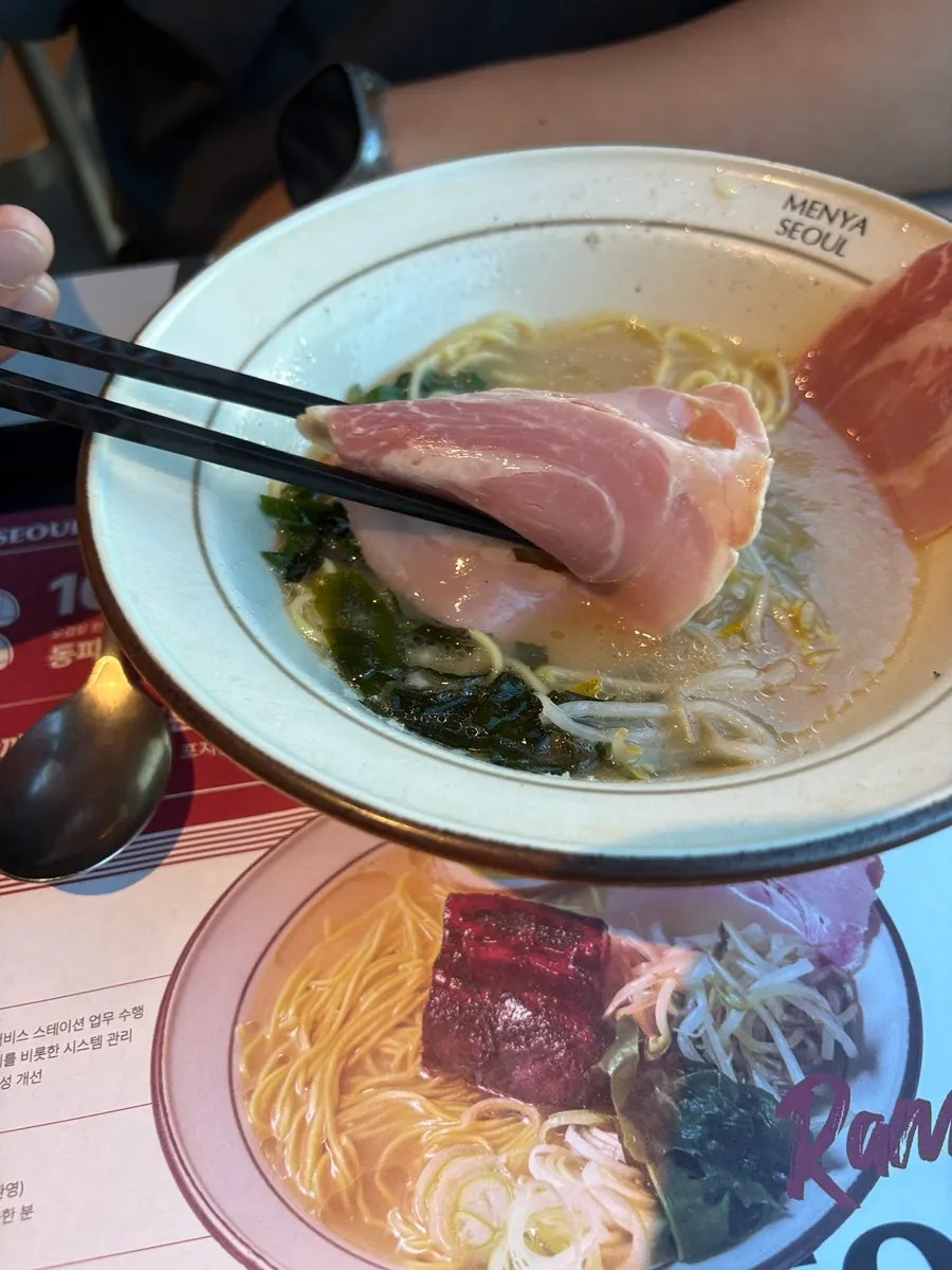 Close-up of thick dongpo pork and chashu toppings