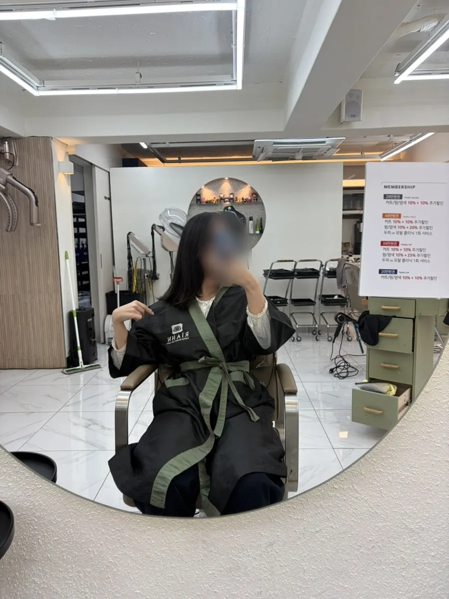 Long, untidy black hair before the treatment