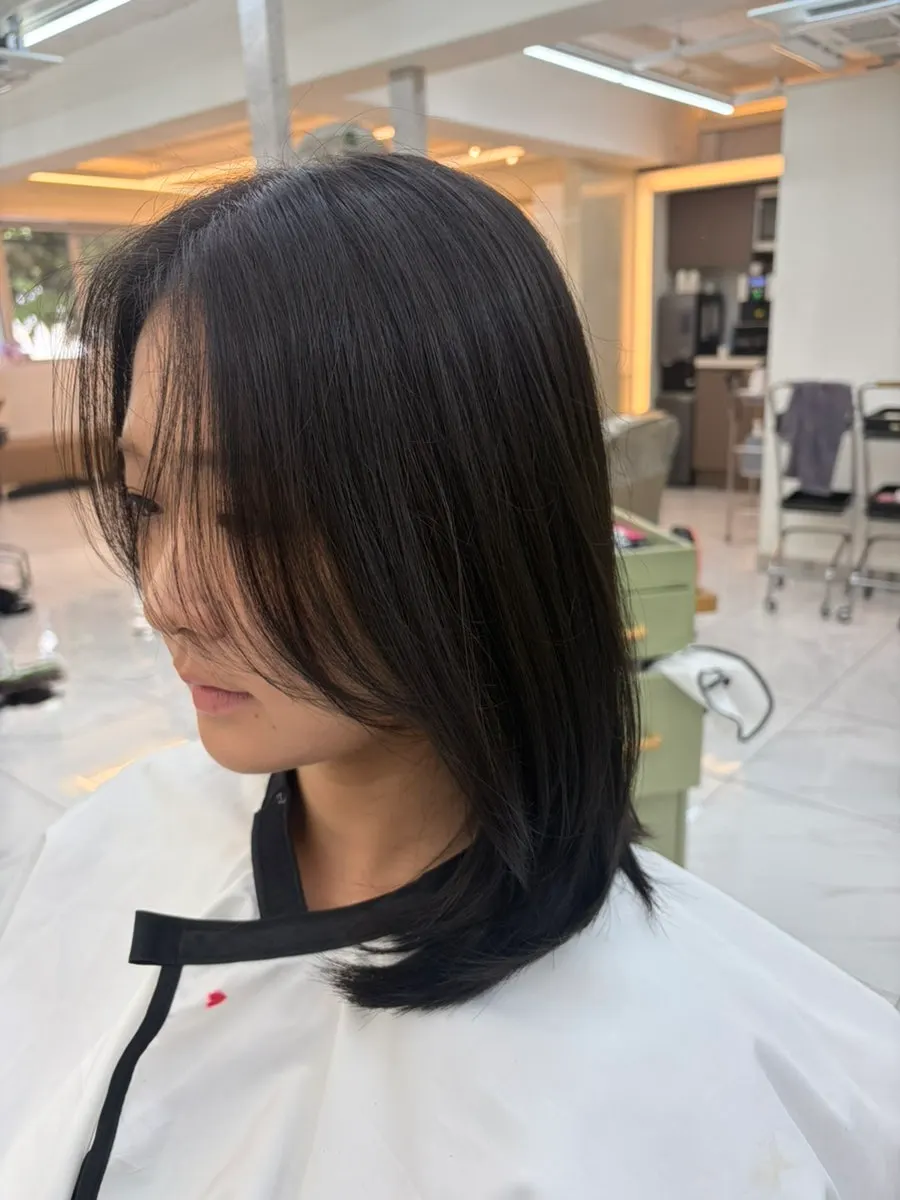 Medium-length hair after dye and layered cut