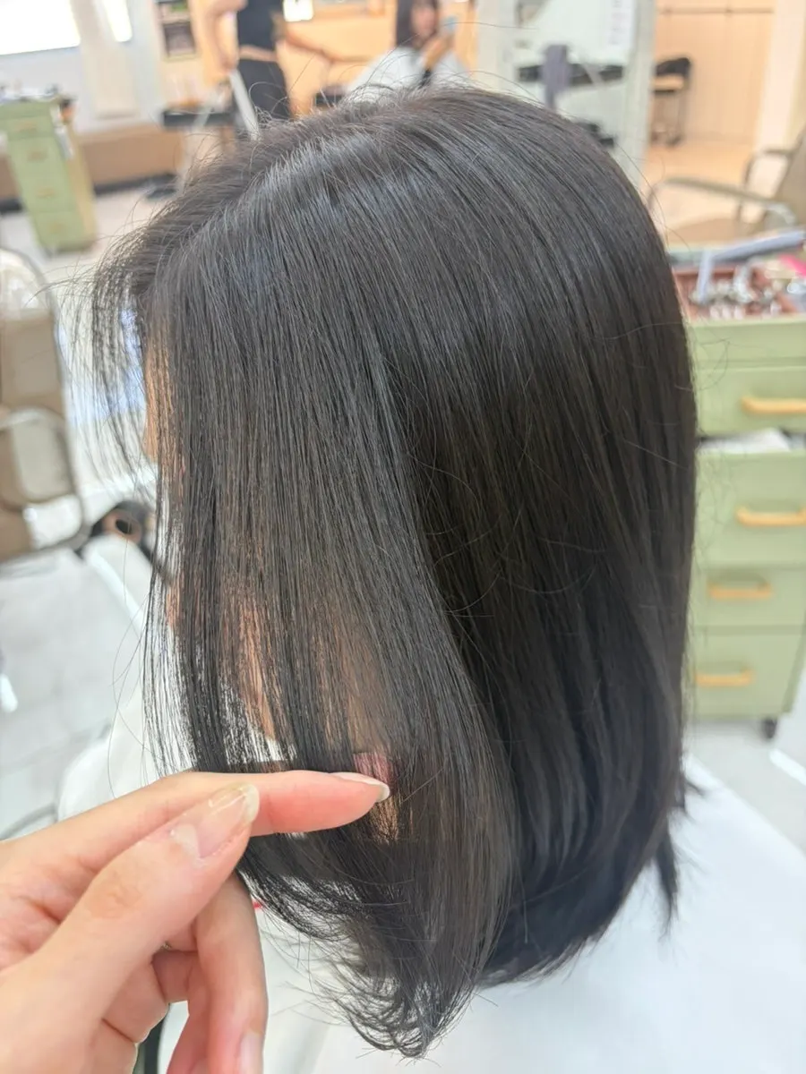Medium-length layered cut in matte brown color