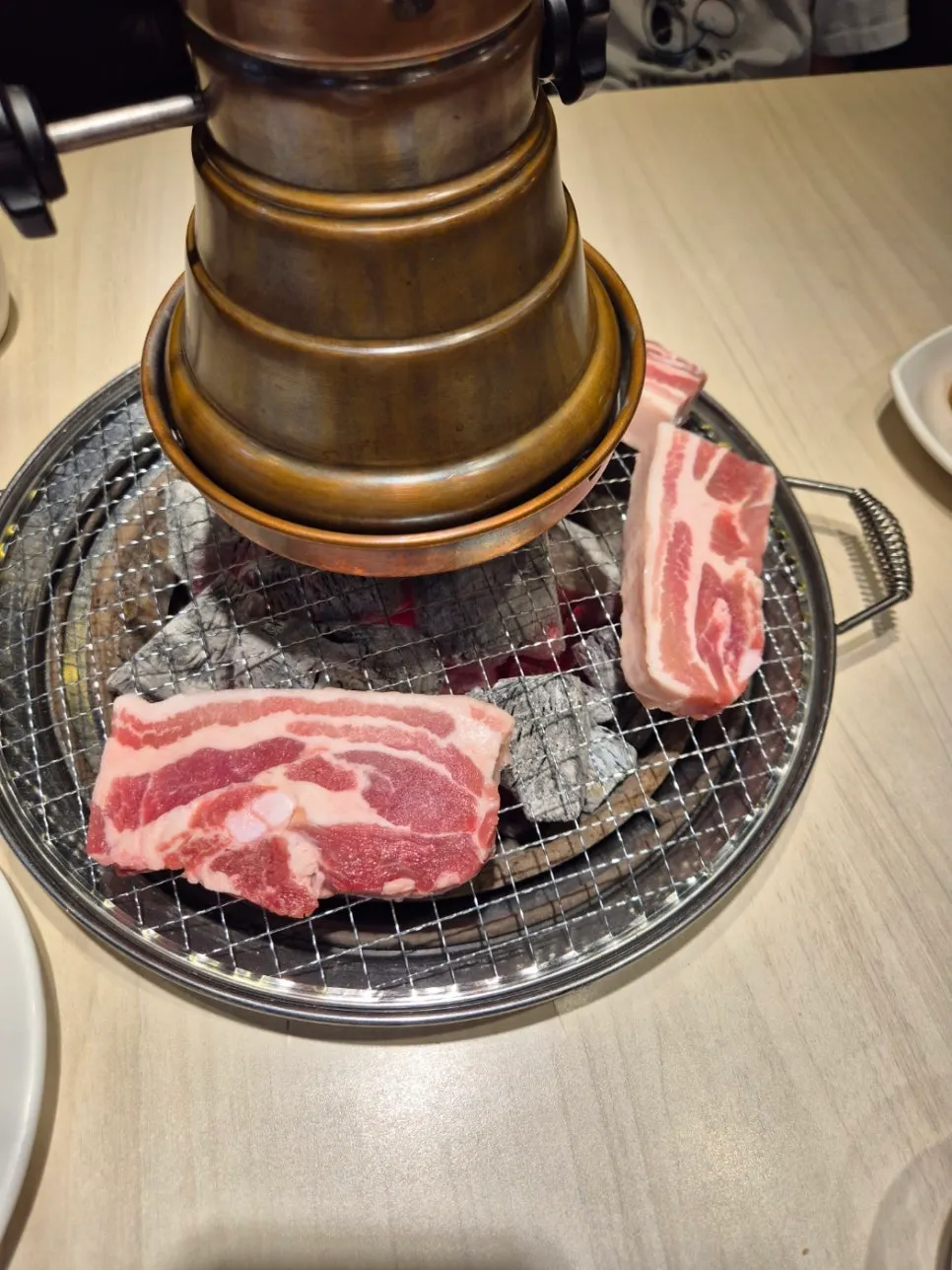 Marinated galbi cooking on the grill