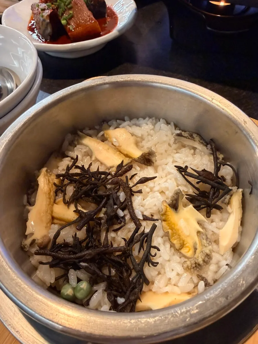 A corner of the restaurant decorated with Jeju-style objects
