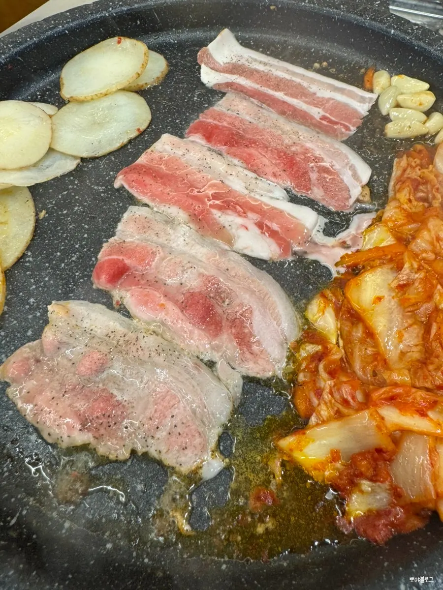 Frozen pork belly on a lettuce wrap