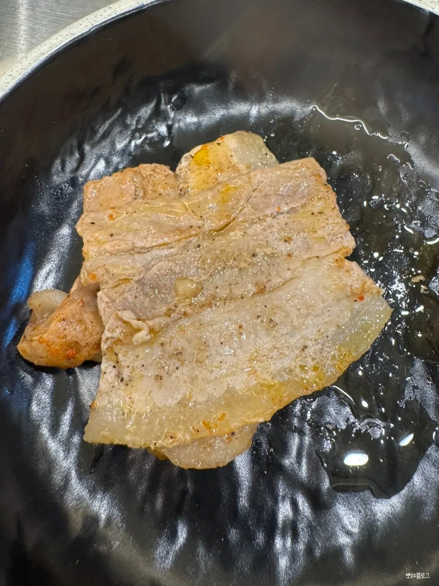 A piece of naengsam paired with grilled kimchi