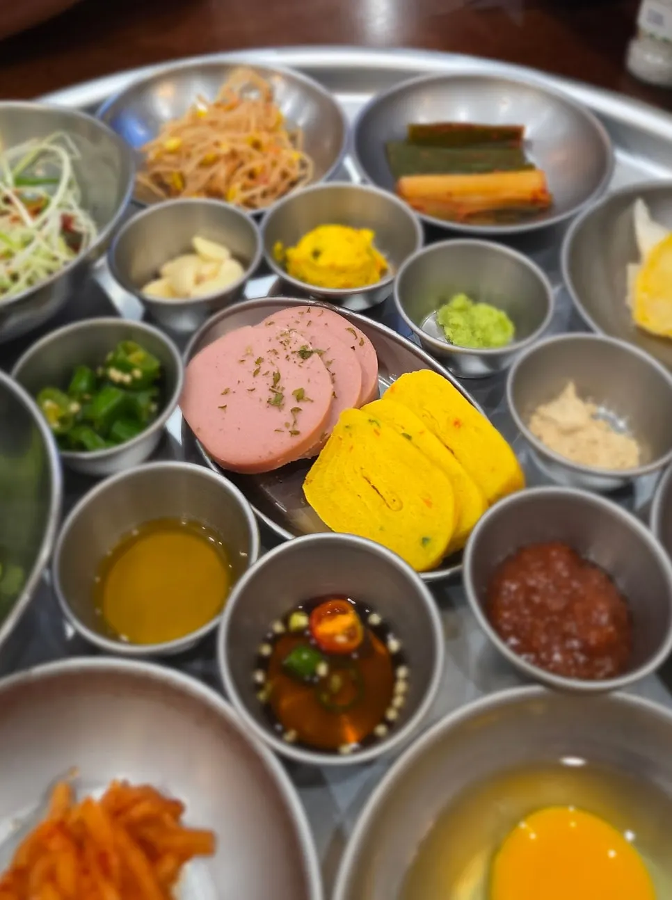 Naengsamok's basic side dish spread piled high on a large tray