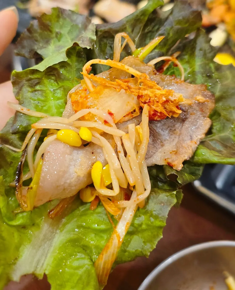 A wrap of frozen pork belly with vegetables