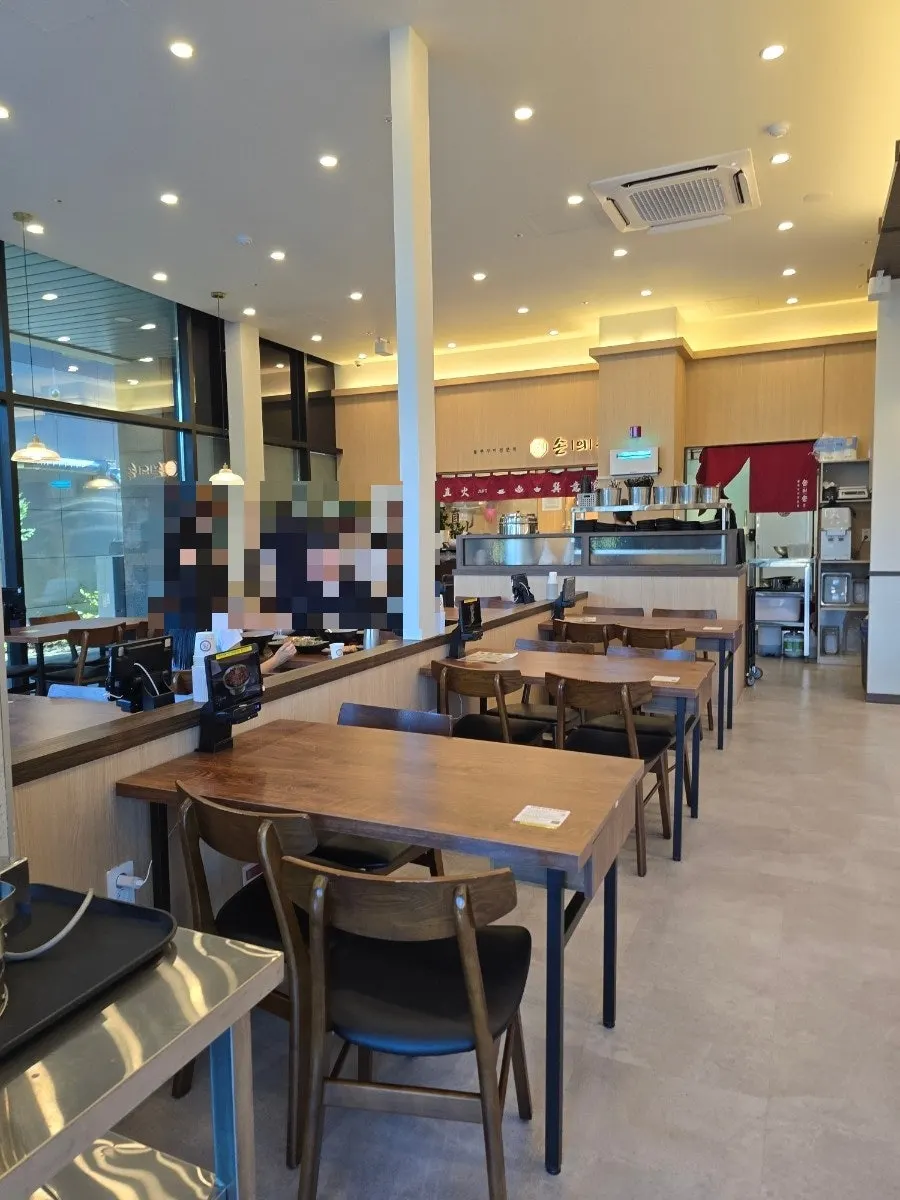 Interior of the restaurant with 4-person tables