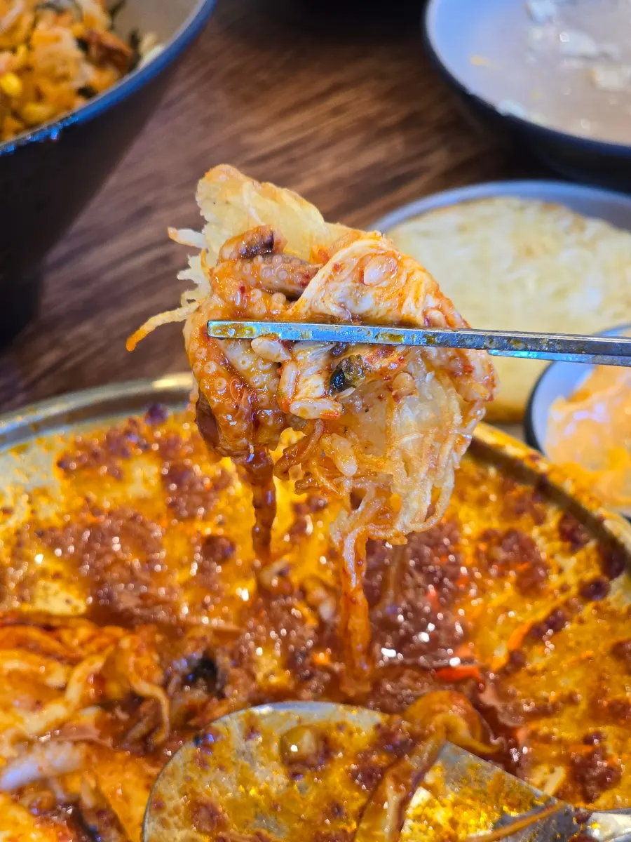 Three pieces of potato pancake served with nacho sauce
