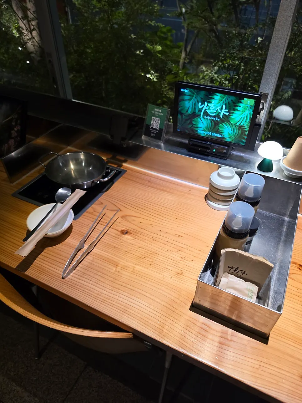 Solo induction burner and pot set up on a wooden table