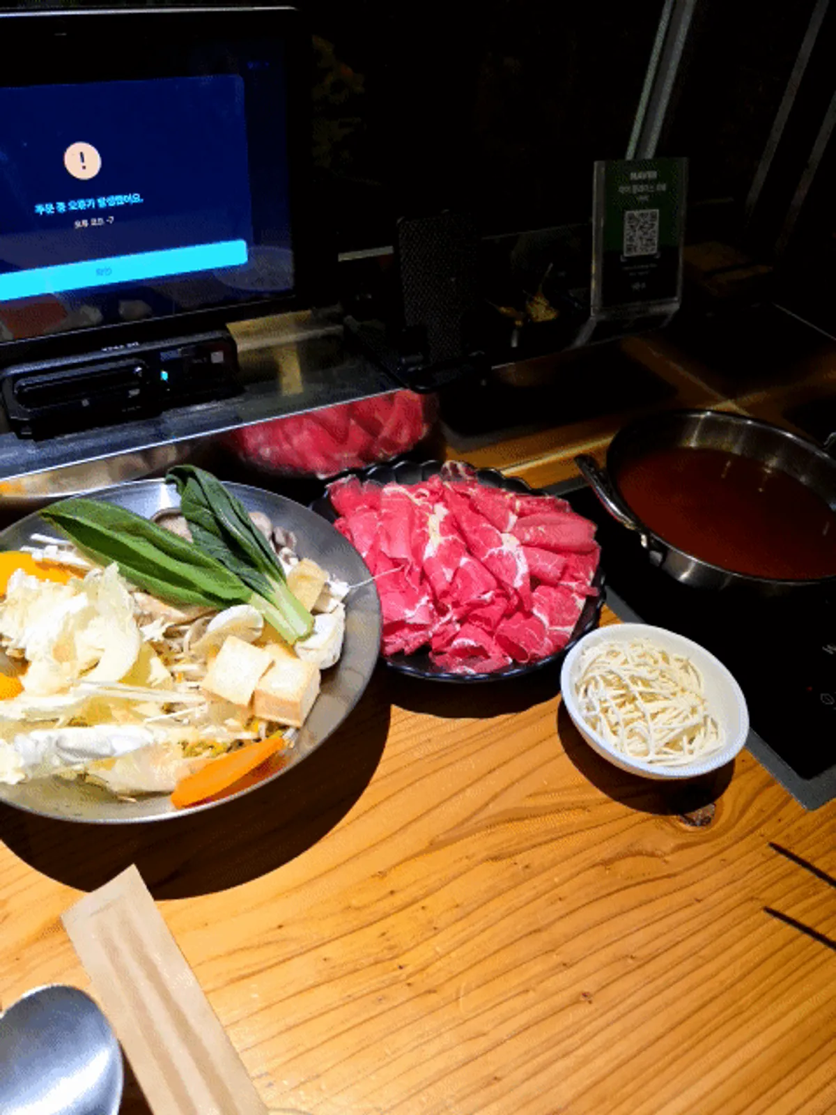 Solo pot with vegetables added to the red spicy broth