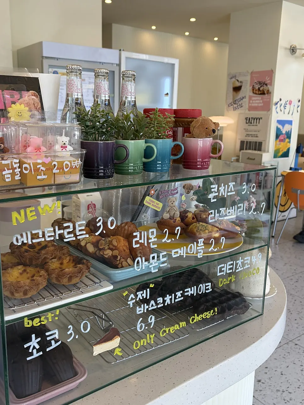 Egg tarts and desserts displayed at the counter