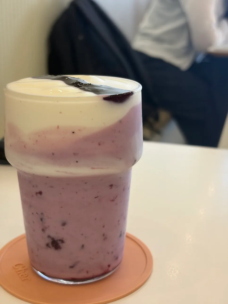 Close-up of a glass of blueberry real yogurt