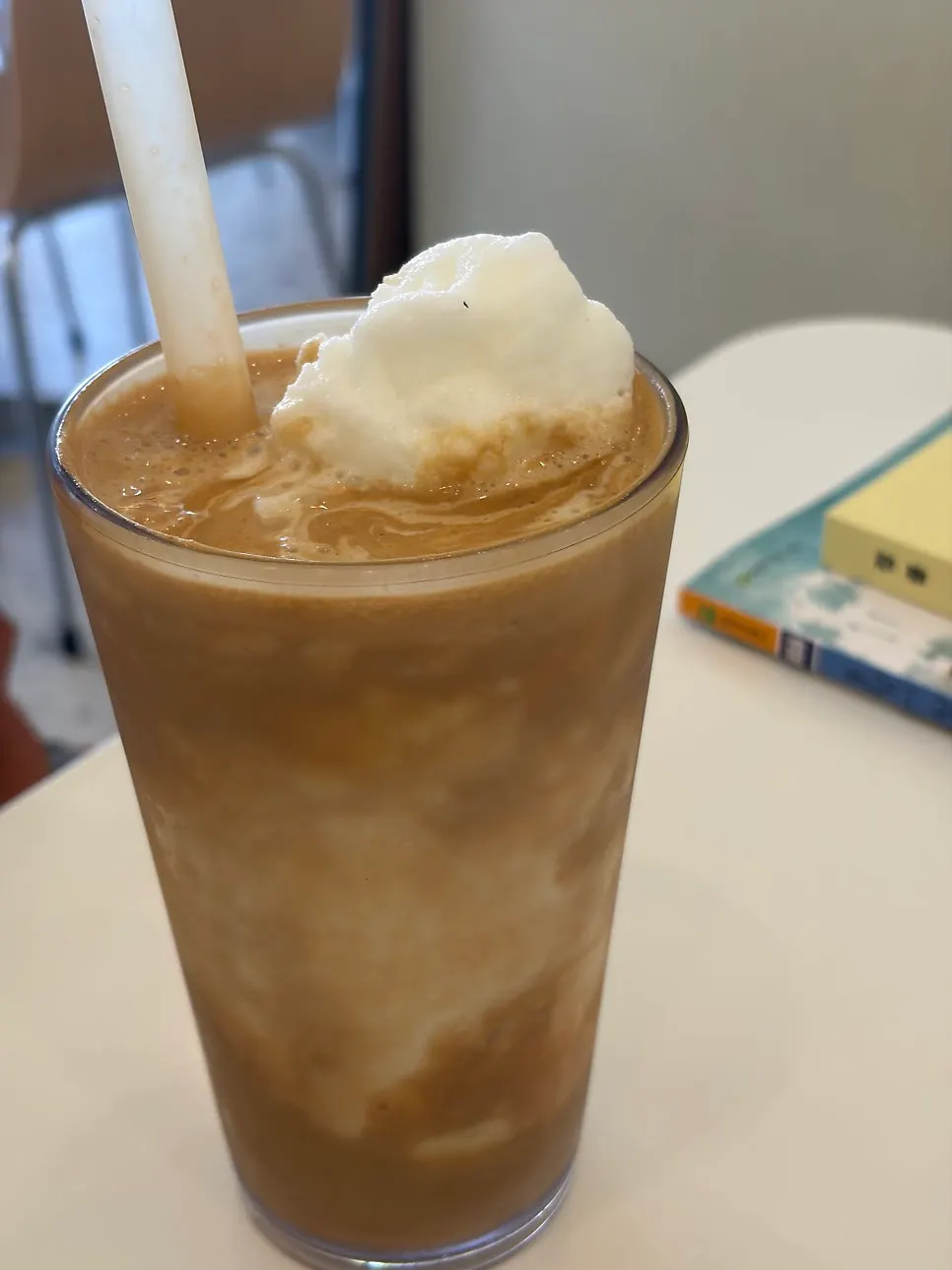 Iced americano placed alongside dessert