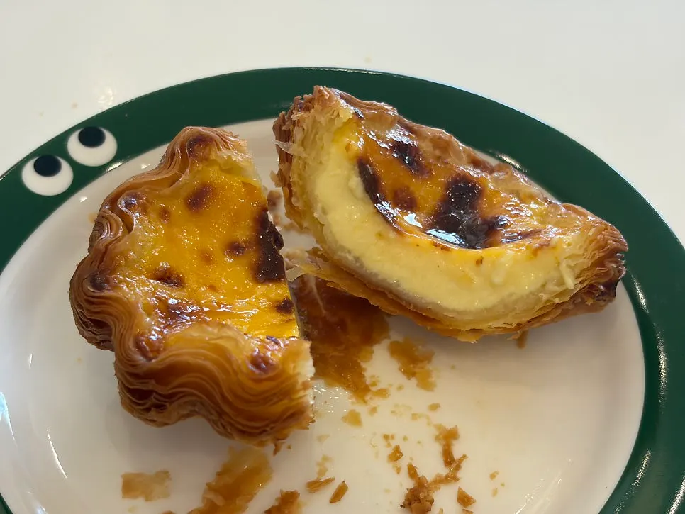 Egg tart showing crisp pastry layers