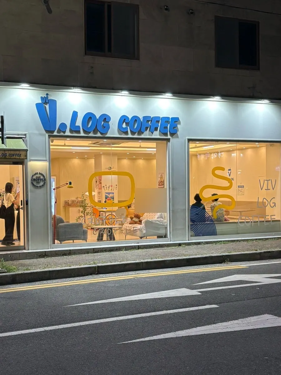 Vibe Log Coffee exterior with full-glass windows