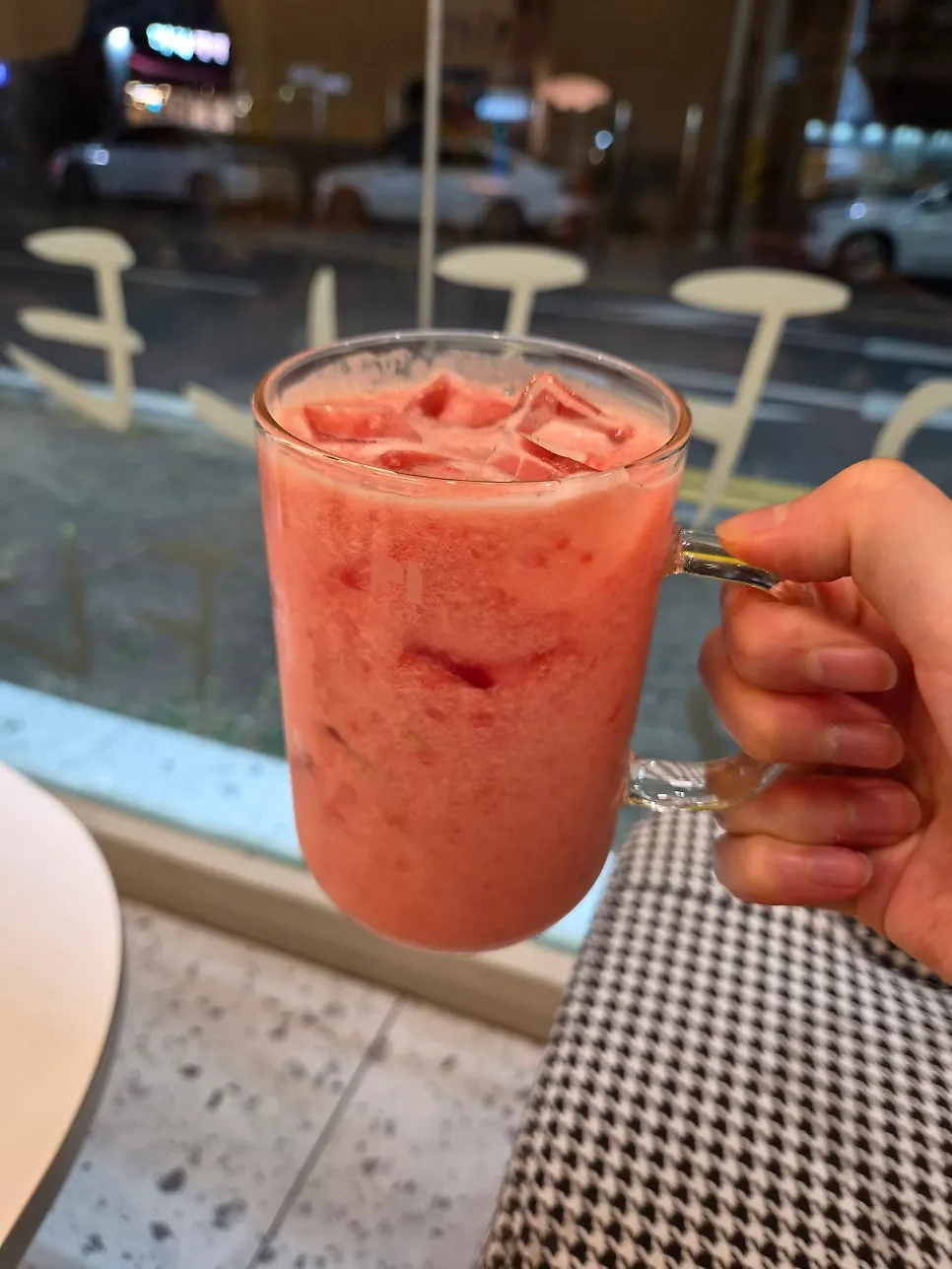 A glass of tomato juice made from blended fruit only