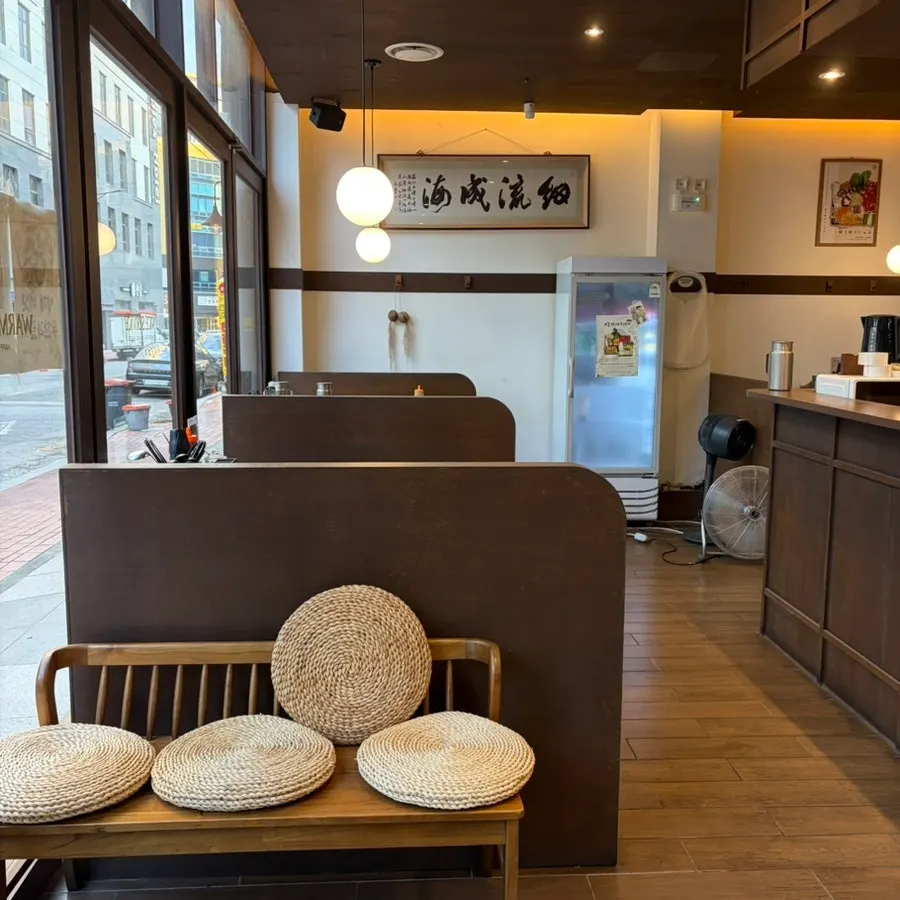 Menu board showing shabu-shabu and cypress-steamed dishes at Yuyu Shabu Naju Innovation City branch
