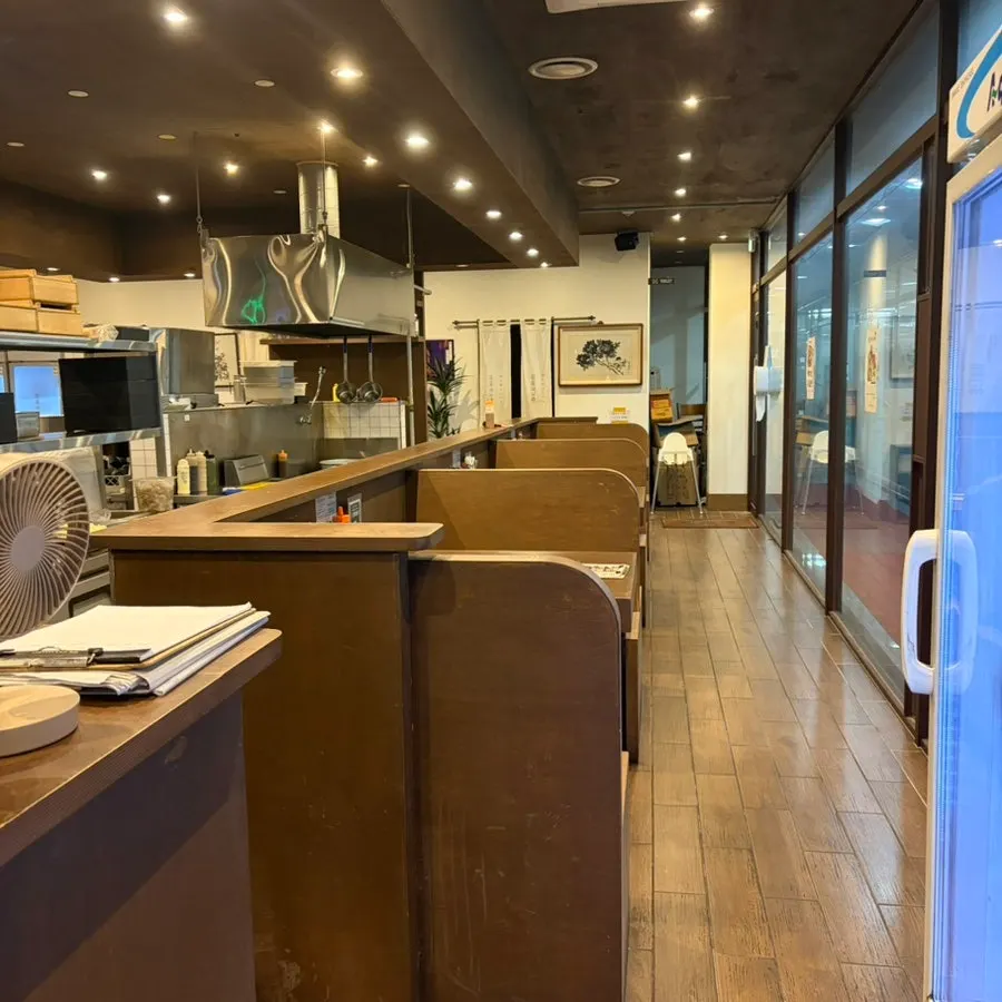Dining hall with view of the open kitchen at Yuyu Shabu Naju Innovation City branch