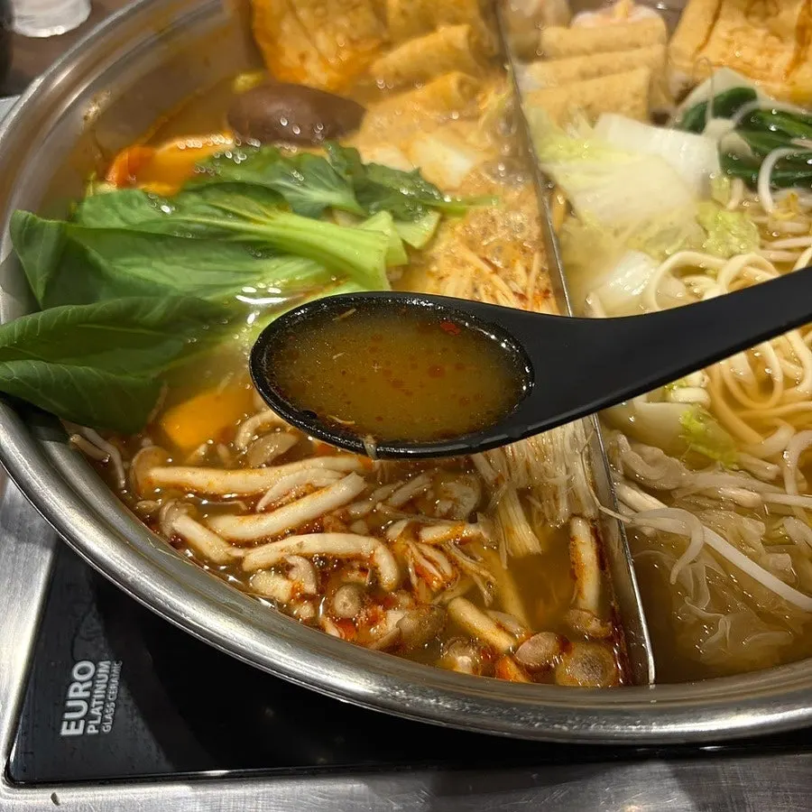 Pot split into basic broth and mala broth halves