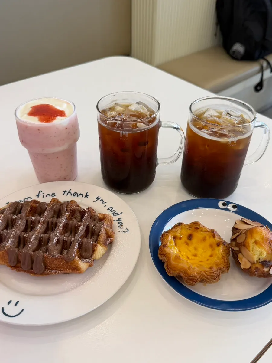 Full spread of ordered coffee and desserts