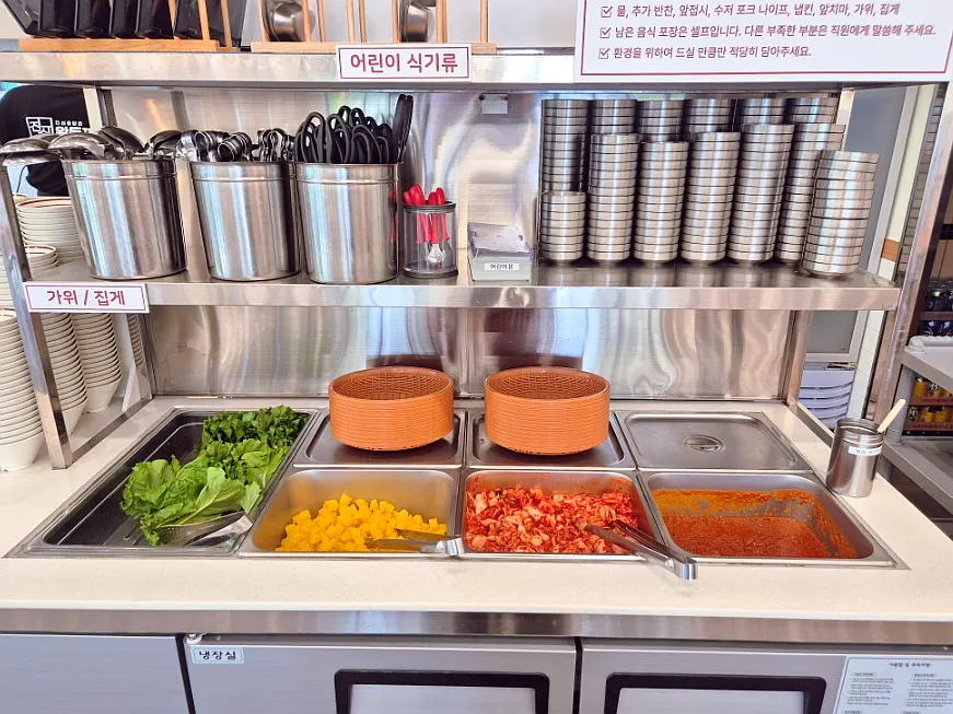 Kimchi, pickled radish, and lettuce wraps at the self-serve bar