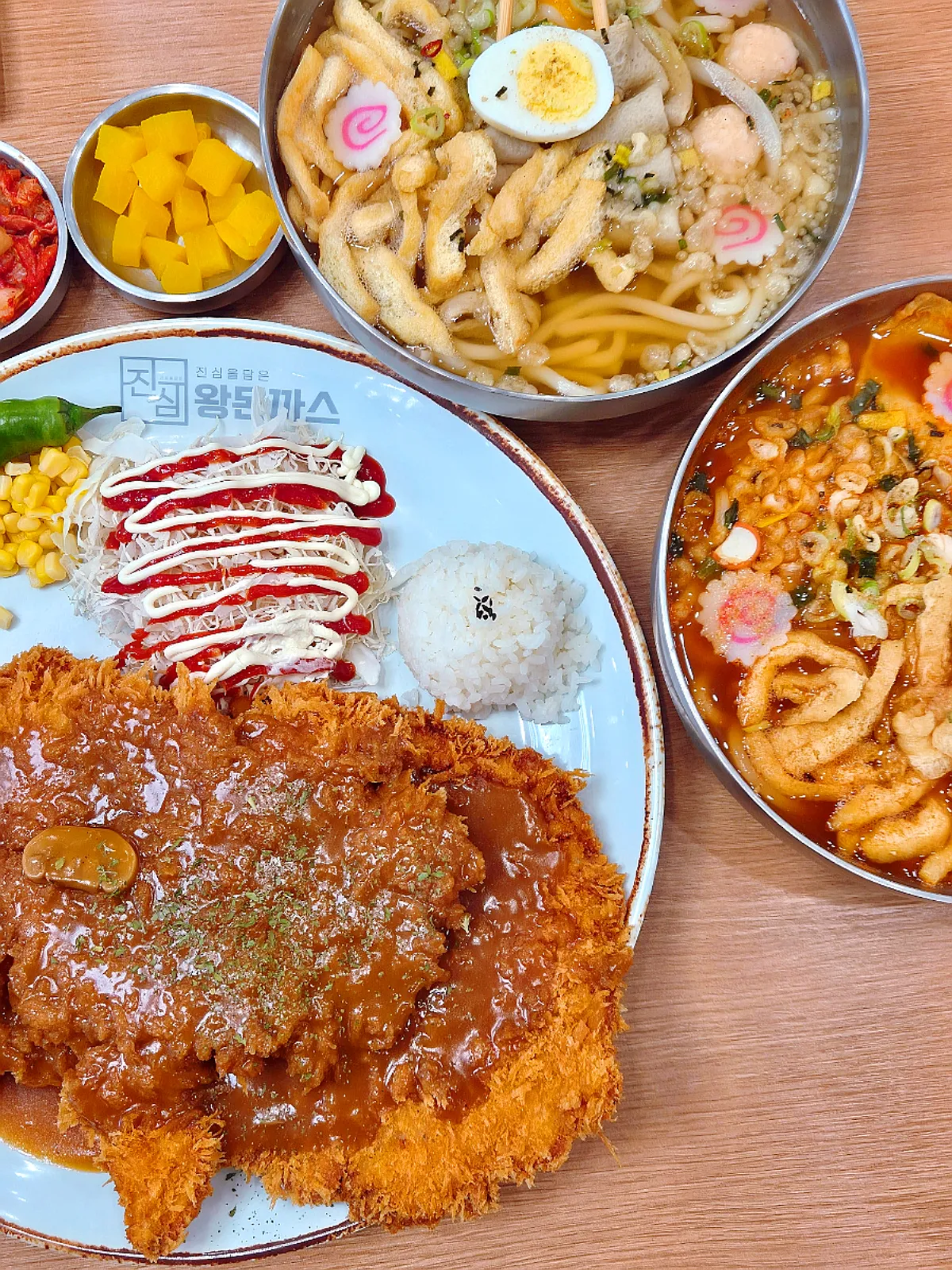Jinsim Wang Double Pork Cutlet with sauce poured on top