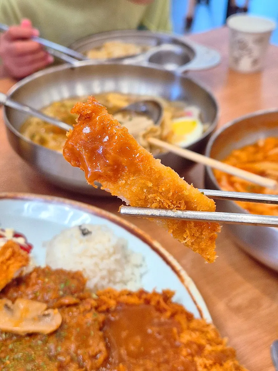 Piece of pork cutlet dipped in thickened sauce