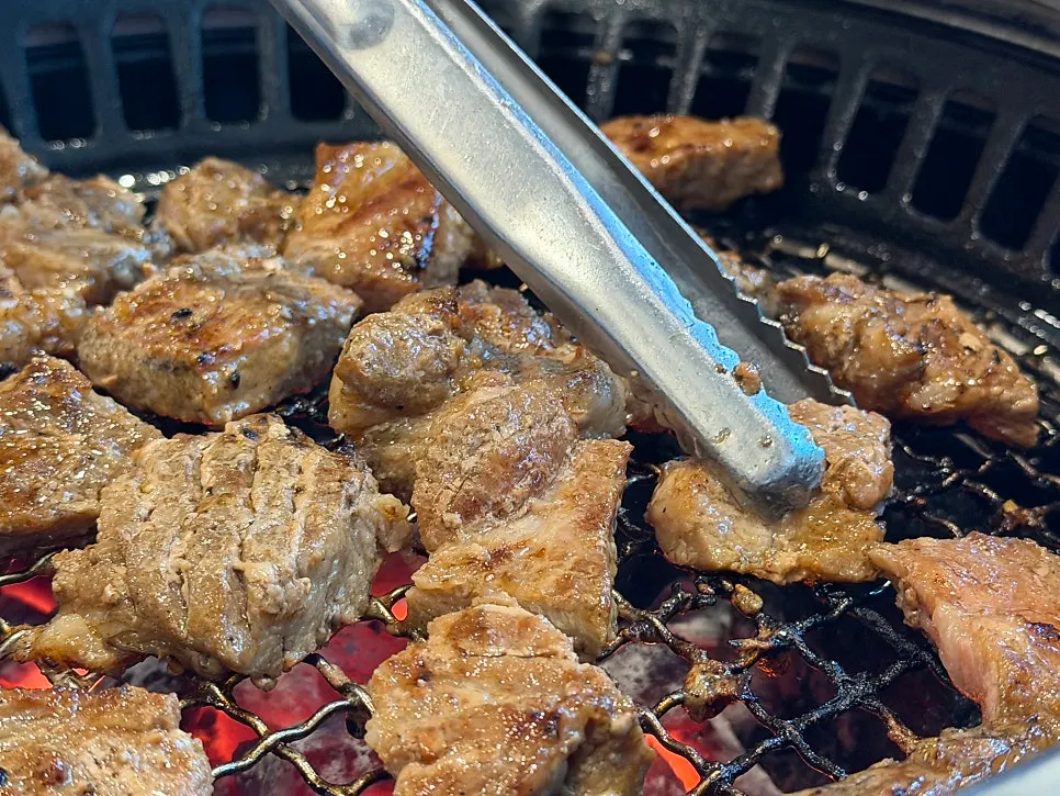 A grilled piece of galbi with lettuce wrap