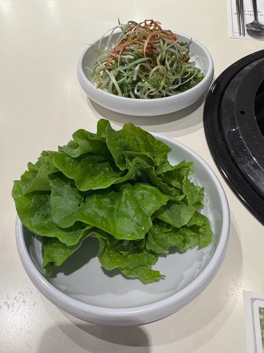 Plate of basic side dishes and organic lettuce wraps