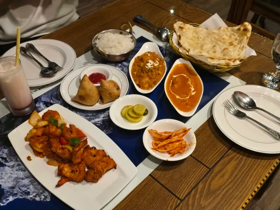Full table view of the couple set at Namaste Dongmyo Branch