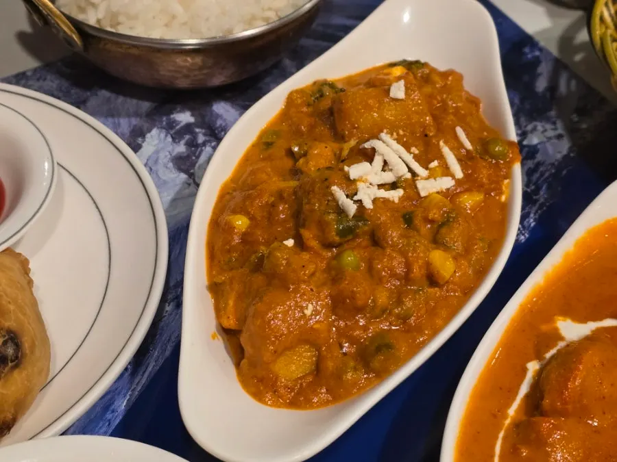Chicken tikka and shrimp chili plated together