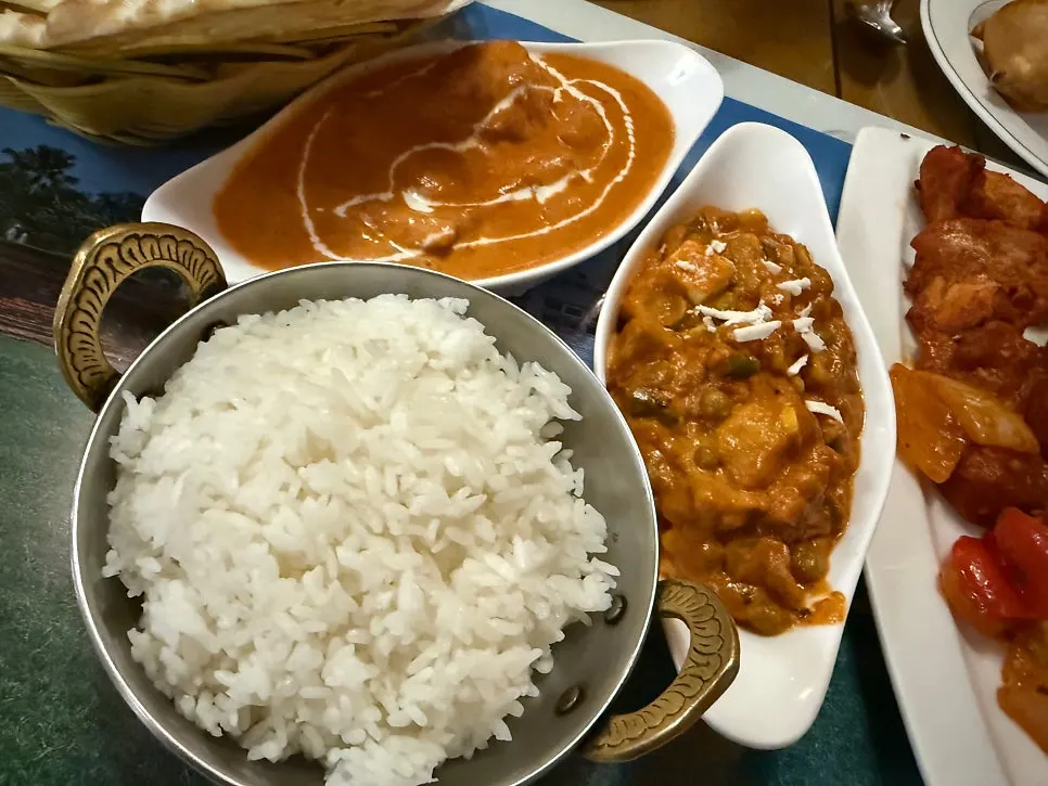 Dipping naan into curry