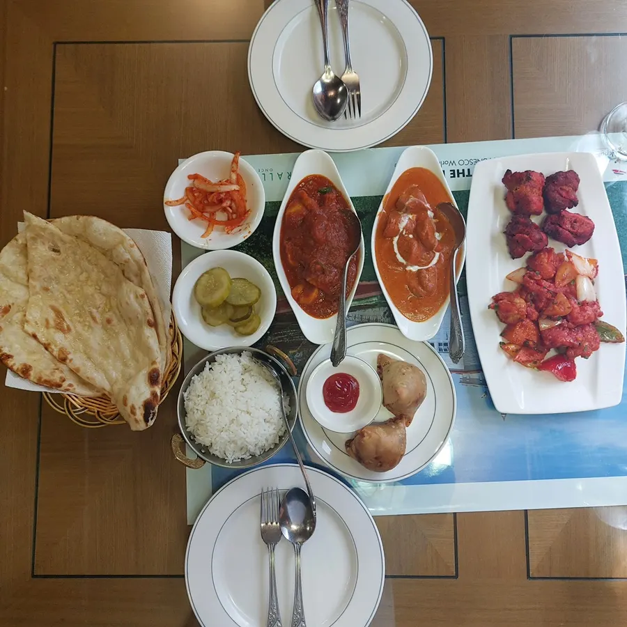 Table fully spread with Namaste Dongmyo Branch's couple set