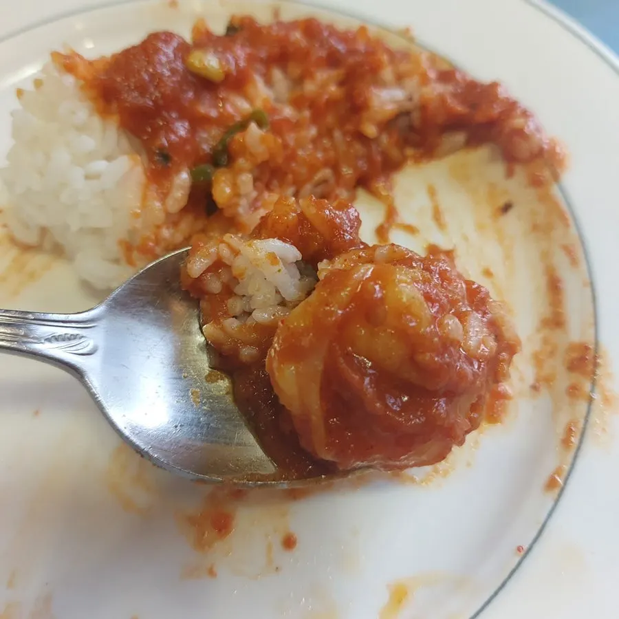 Shrimp vindaloo served out onto a plate