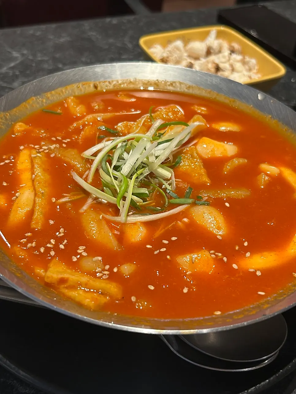 Soup tteokbokki loaded with rice cakes and fish cakes