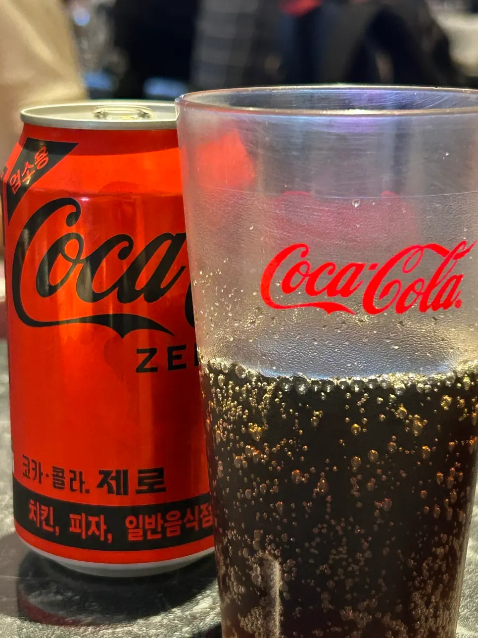 A glass of zero-calorie cola on the table with chicken