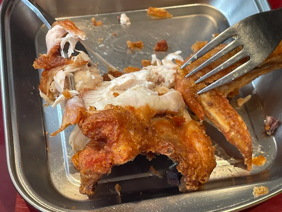 Chicken piece with breast meat and wing attached
