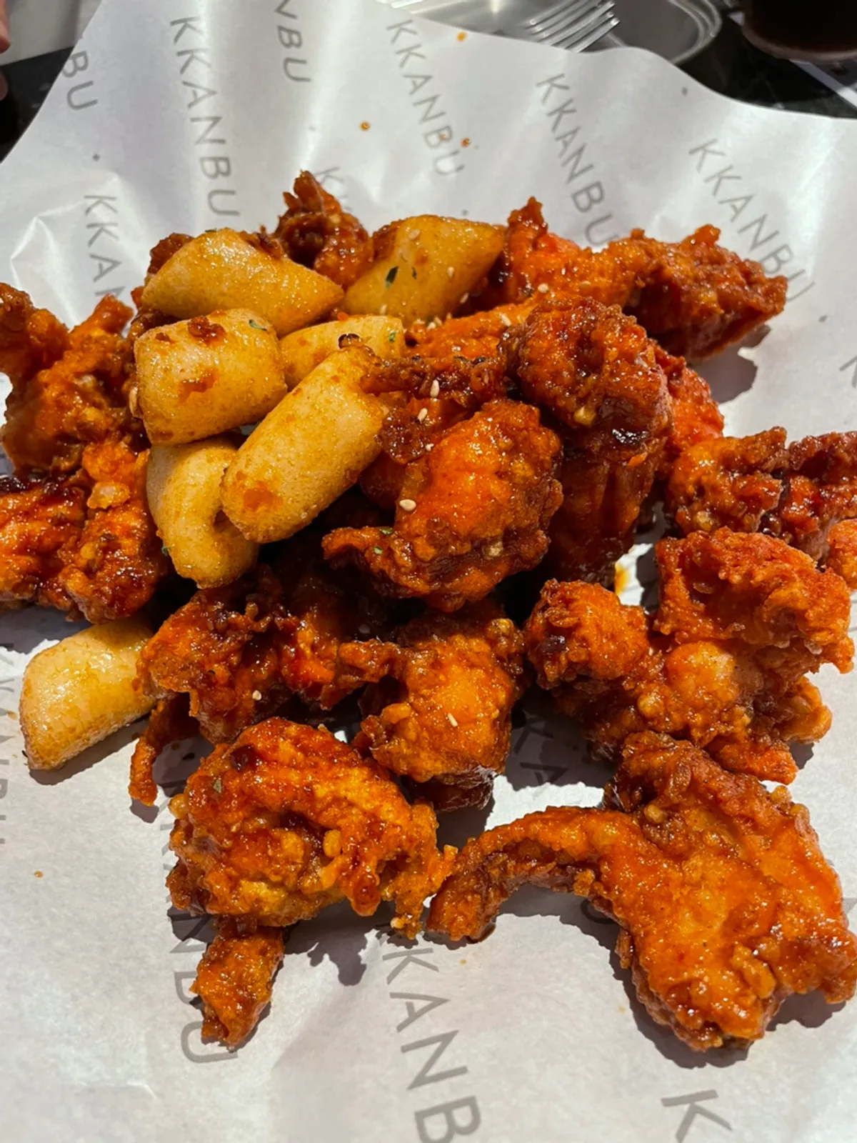 A glossy plate of garlic soy boneless chicken