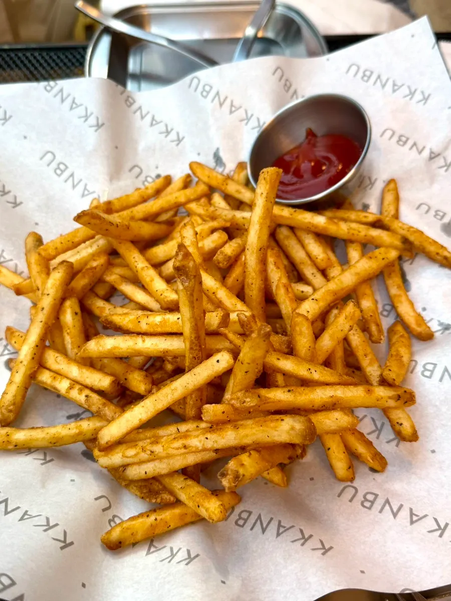 A plate of thin, crispy Cajun potatoes