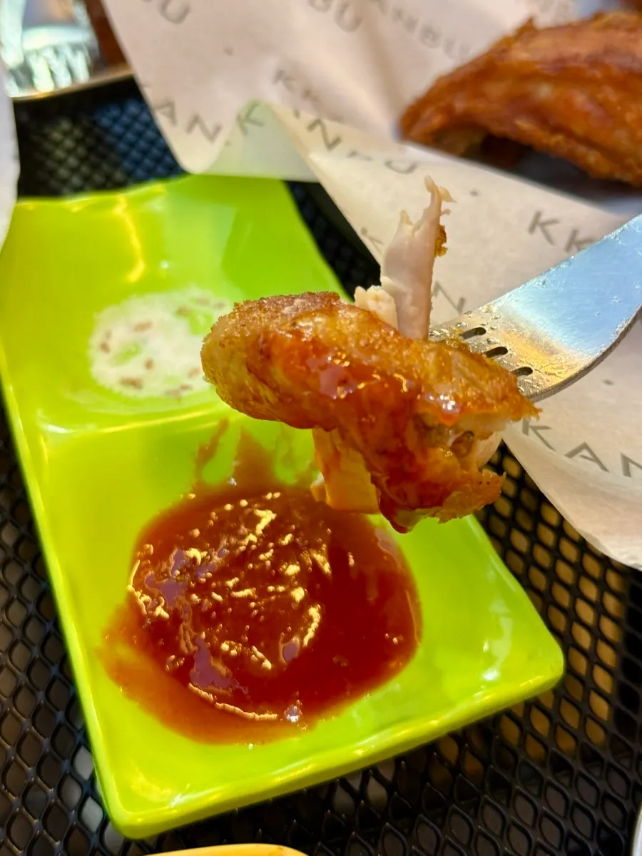 Crispy Six Pack chicken dipped in chili sauce
