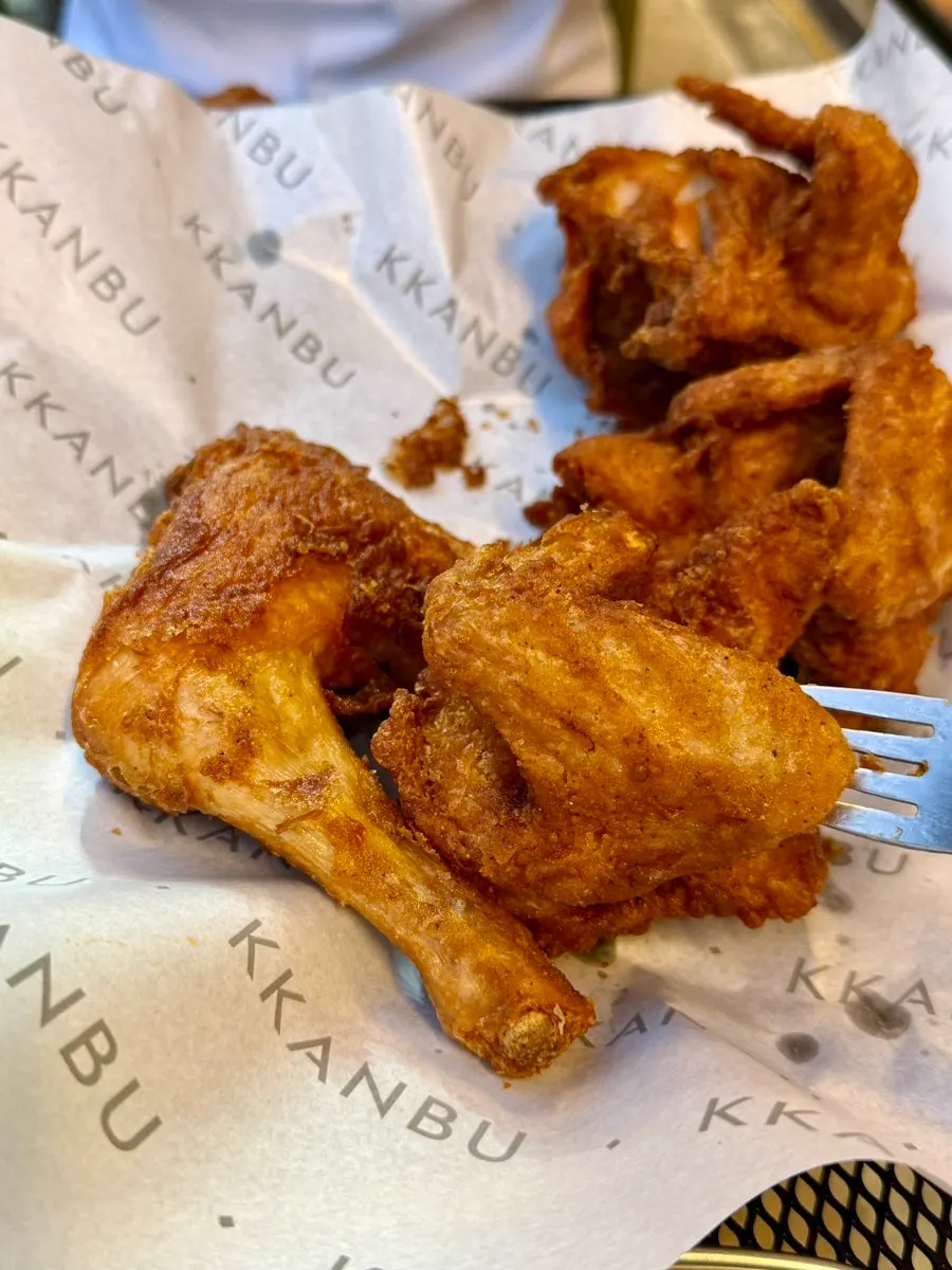 Close-up of a large fried chicken wing piece
