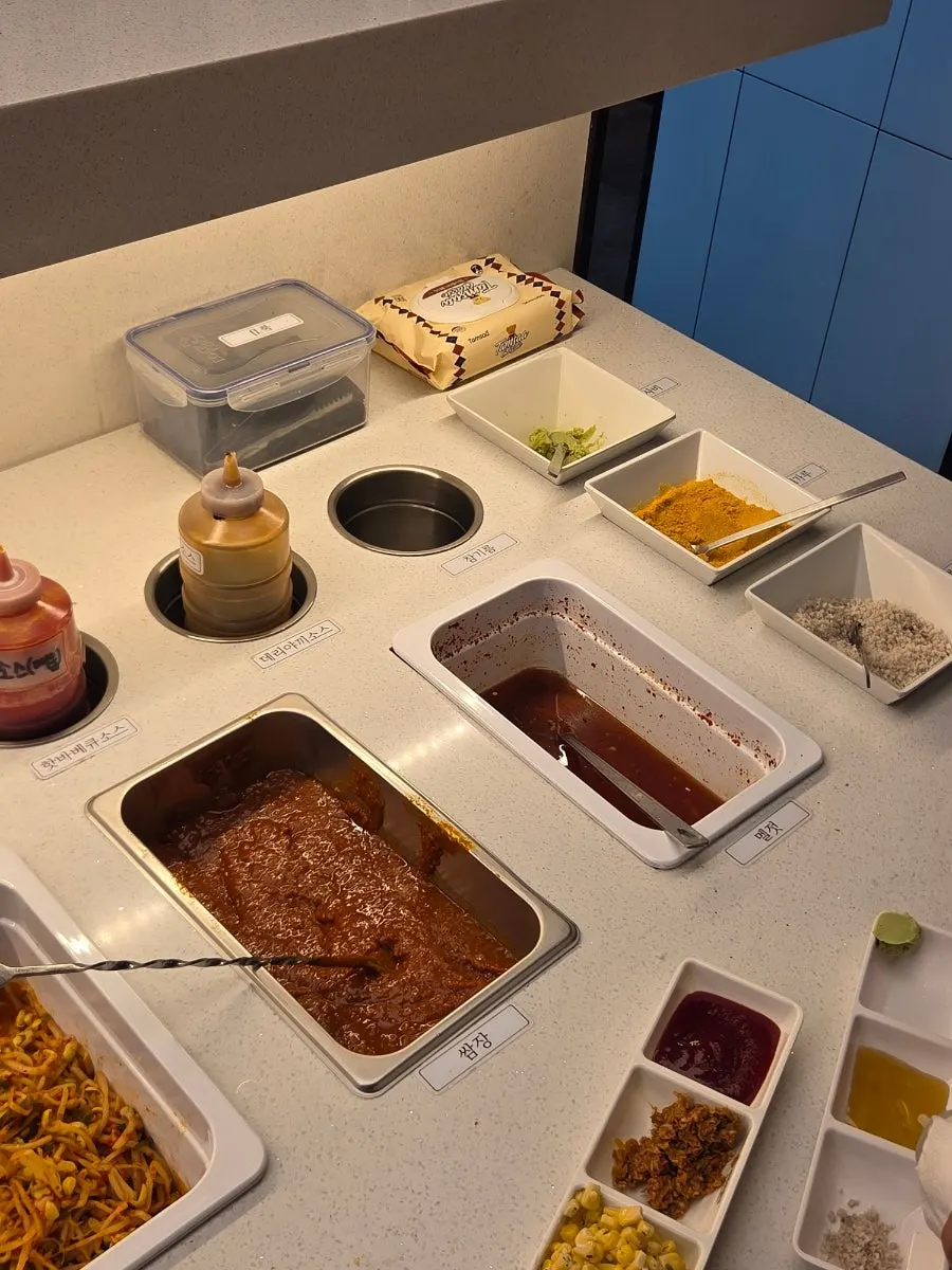 Gat kimchi and bean sprouts among the self-serve bar side dishes