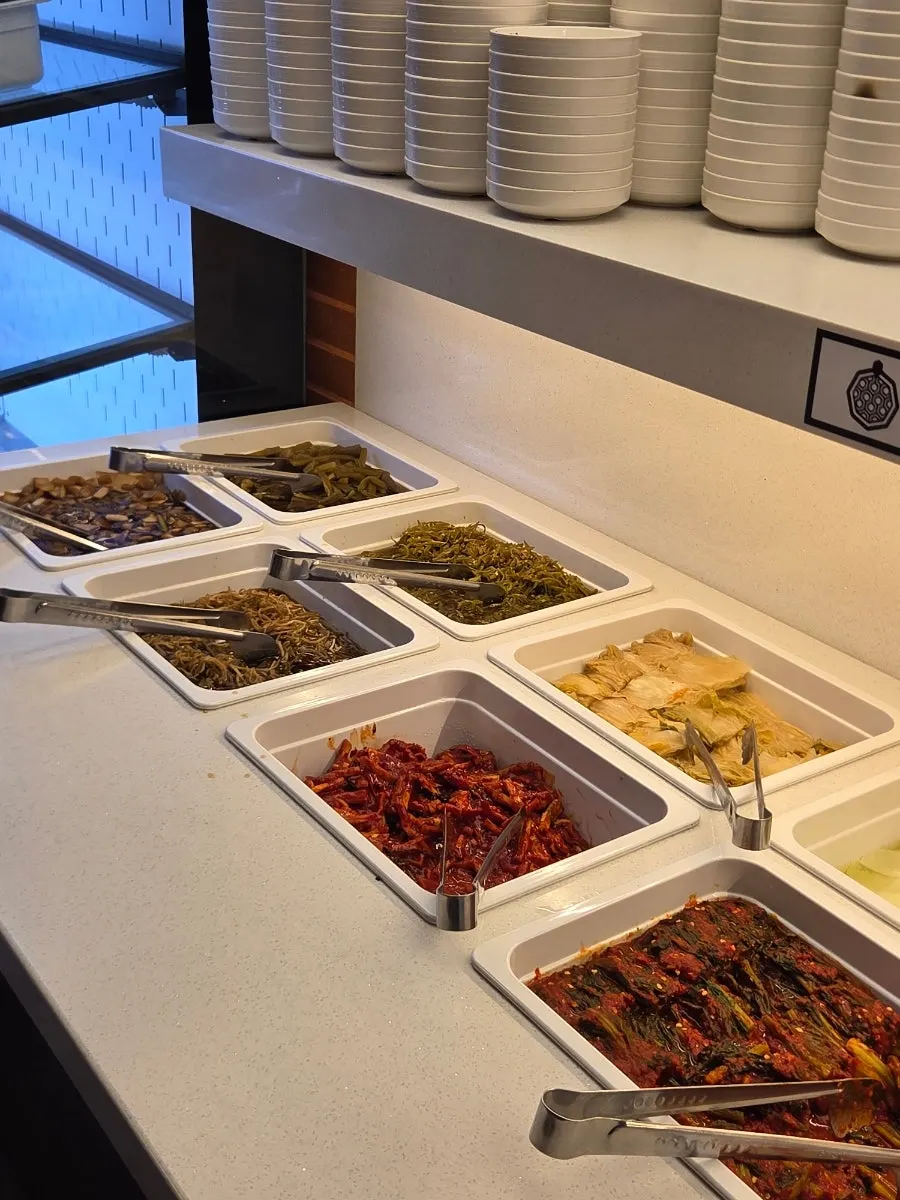 Pickled onions and gungchae at the self-serve bar